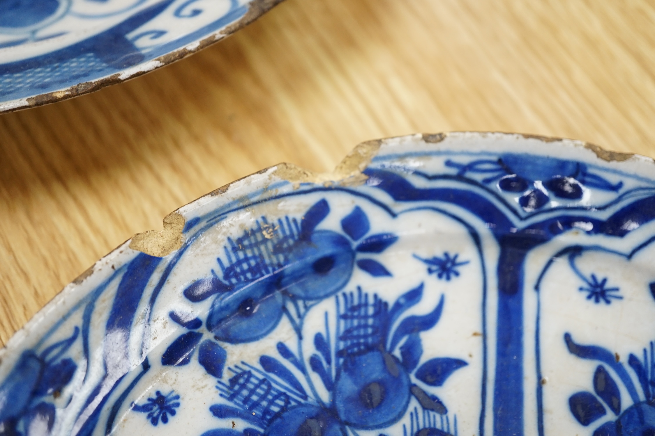 Four various continental delftware dishes, 18th and 19th century, largest 31cm diameter. Condition - various cracks and chipping to edges